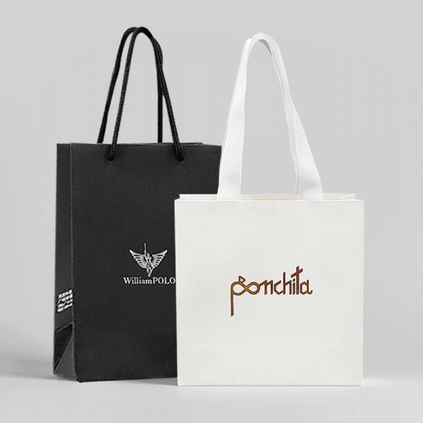 Cheap Luxury Clothing Paper Shopping Bags White Gift Bags With Ribbon Handles for sale