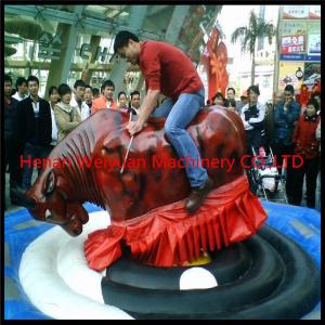 Giant Mechanical Rodeo Bull With Inflatable Mattress Interactive Game In Amusement Park