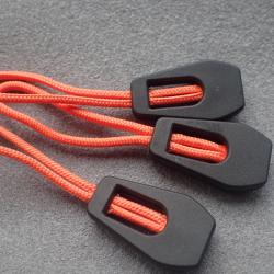 China Durable Embossed Logo PVC Zipper Slider Puller for sale