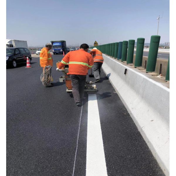Yellow thermoplastic road marking paint showing high visibility