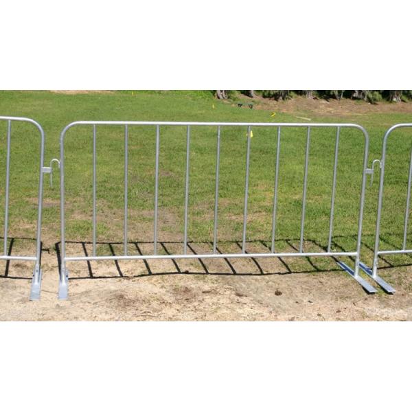 Three pedestrian barrier panels installed with flat feet stand on the lawn, they are interlocked with hook and loop.