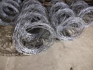 China Hot Dipped Galvanized BTO-18 Concertina Coil Wire Flat Wrap Razor Barbed Wire on sale