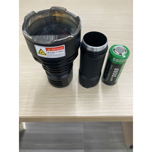 Side view of Aithink L2KM tactical flashlight showing rugged construction